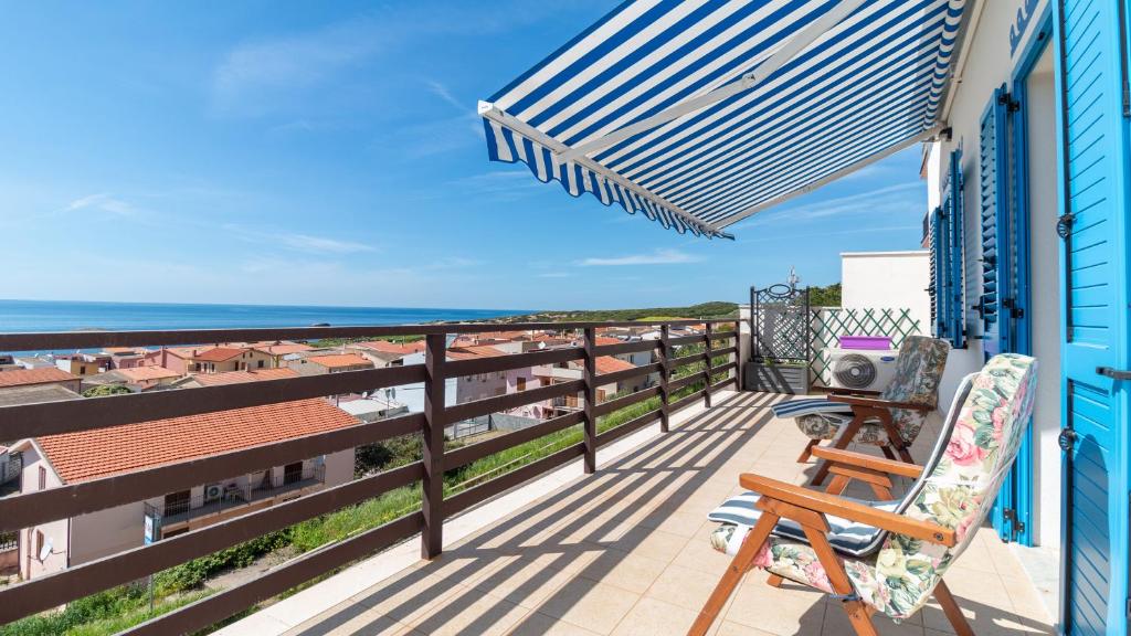 a balcony with a view of the ocean at Panorama Blu in S'archittu Cuglieri