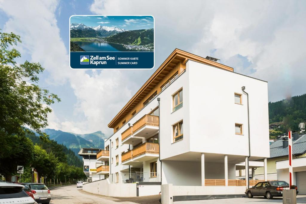 a building with a sign in front of it at AlpenParks Residence Zell am See in Zell am See