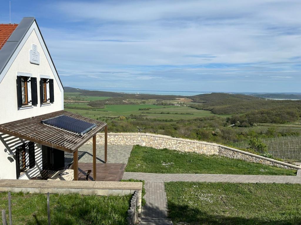 a house with a solar panel on top of it at Borbora Borház Villa in Vászoly