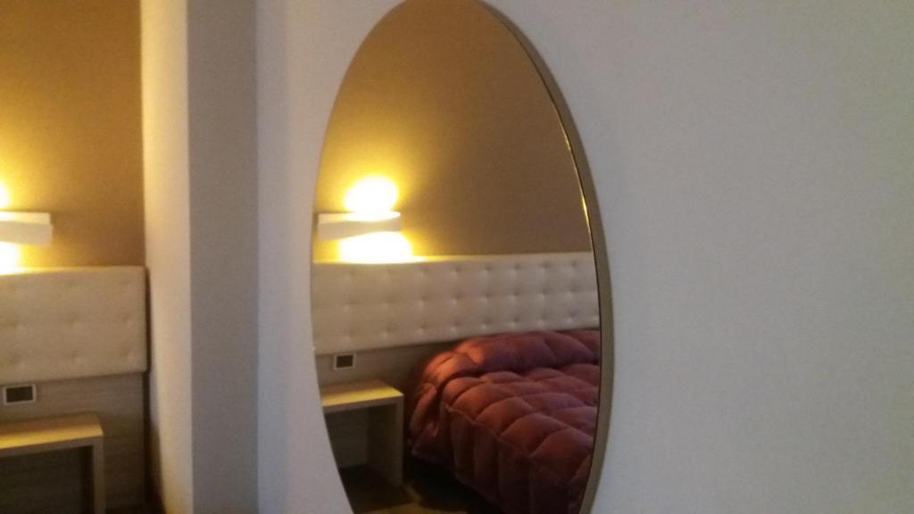 Łóżko lub łóżka w pokoju w obiekcie Hotel Norden Palace