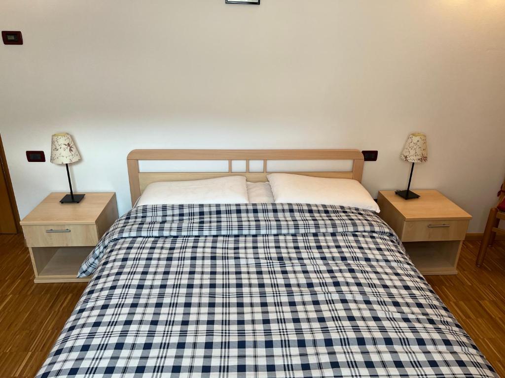 Postel nebo postele na pokoji v ubytování Casa Dalsass