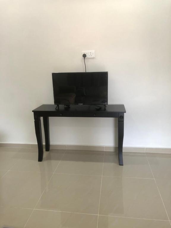 TV a/nebo společenská místnost v ubytování Homestay Siti Klang