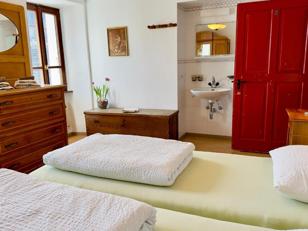 Postel nebo postele na pokoji v ubytování Antica Osteria Dazio