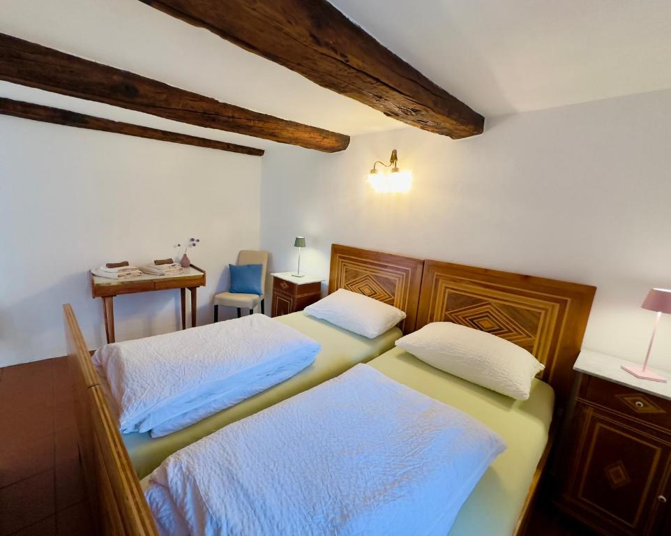Postel nebo postele na pokoji v ubytování Antica Osteria Dazio