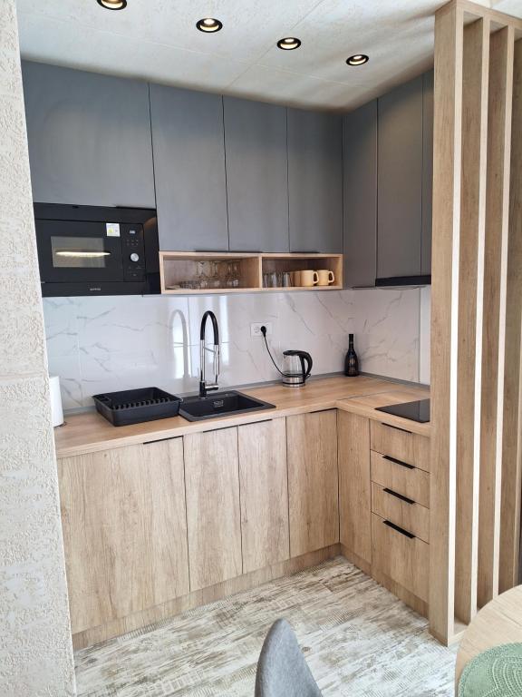 مطبخ أو مطبخ صغير في Apartman Felis Star