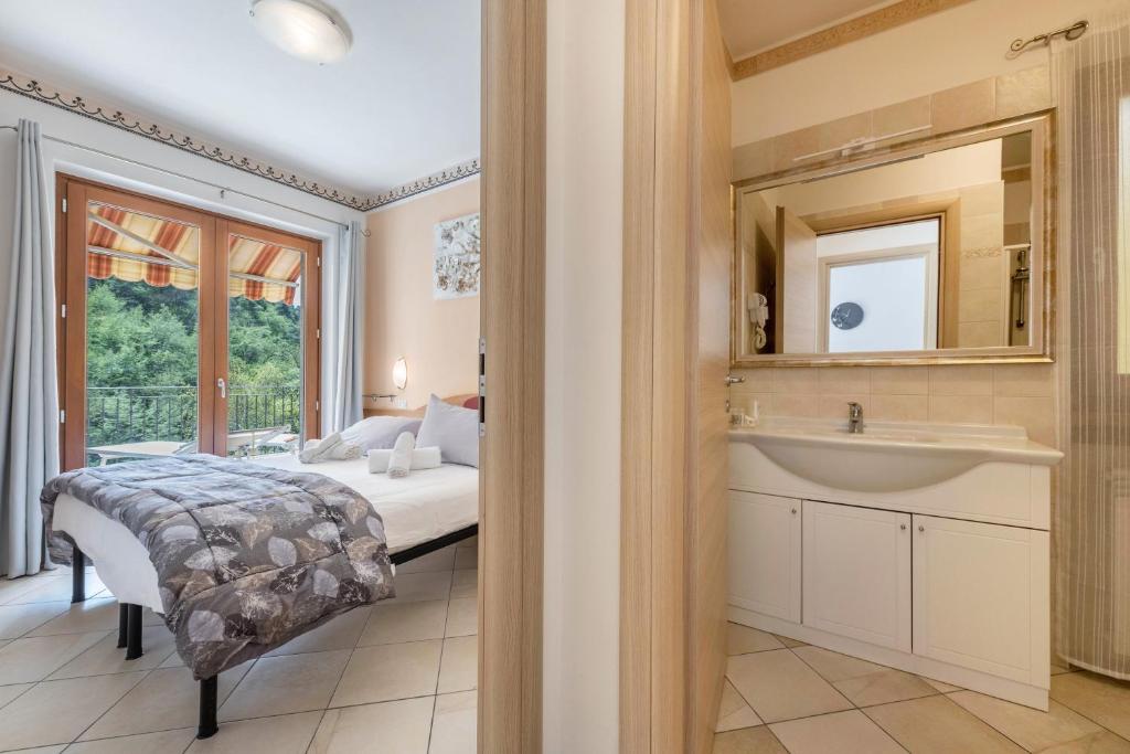 Postel nebo postele na pokoji v ubytování Residence Tatiana A3