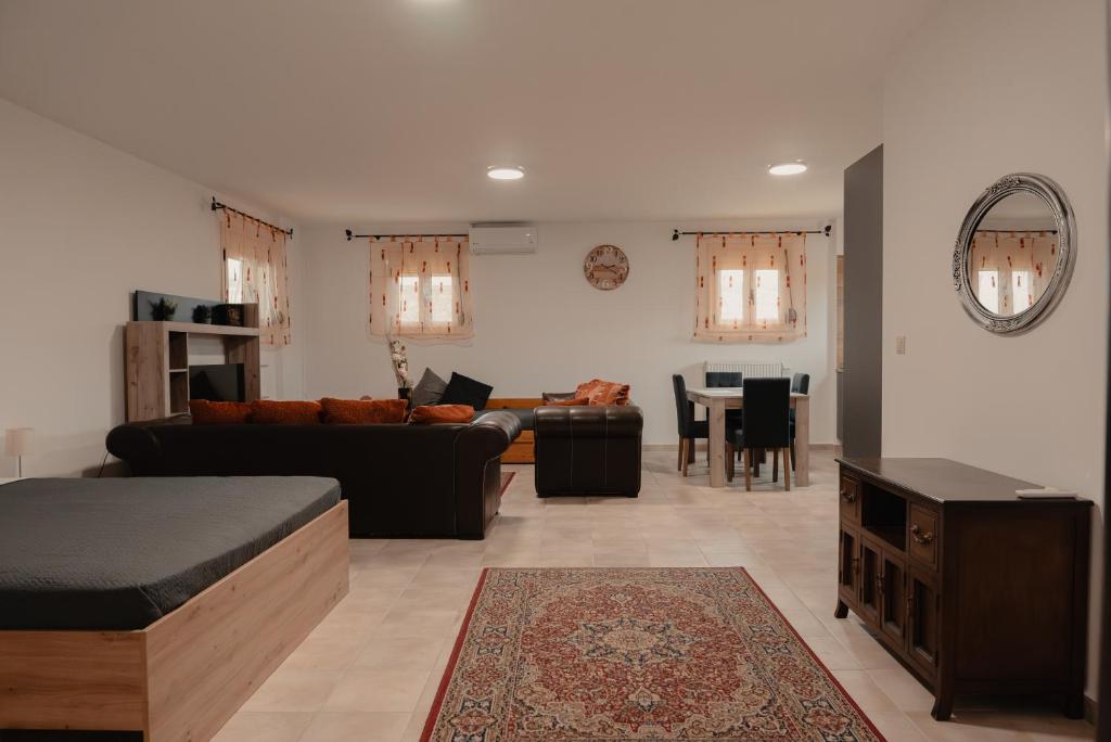 a living room with a couch and a table at Saint Nektarios Ηouse Preveza in Preveza