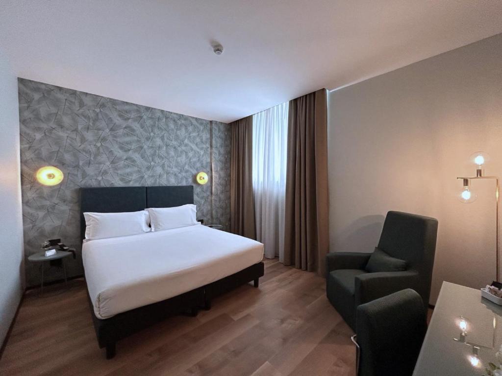 Postel nebo postele na pokoji v ubytování H2C Hotel Milanofiori
