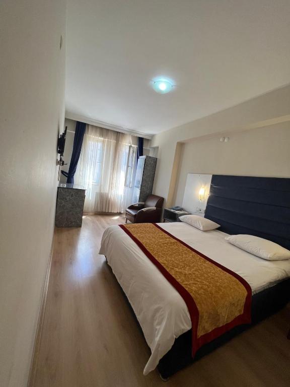 Postel nebo postele na pokoji v ubytování Hotel Yakut