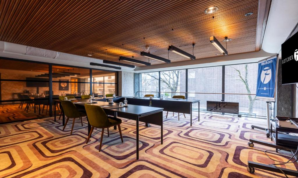 TV a/nebo společenská místnost v ubytování Fletcher Boutique Hotel Slaak-Rotterdam