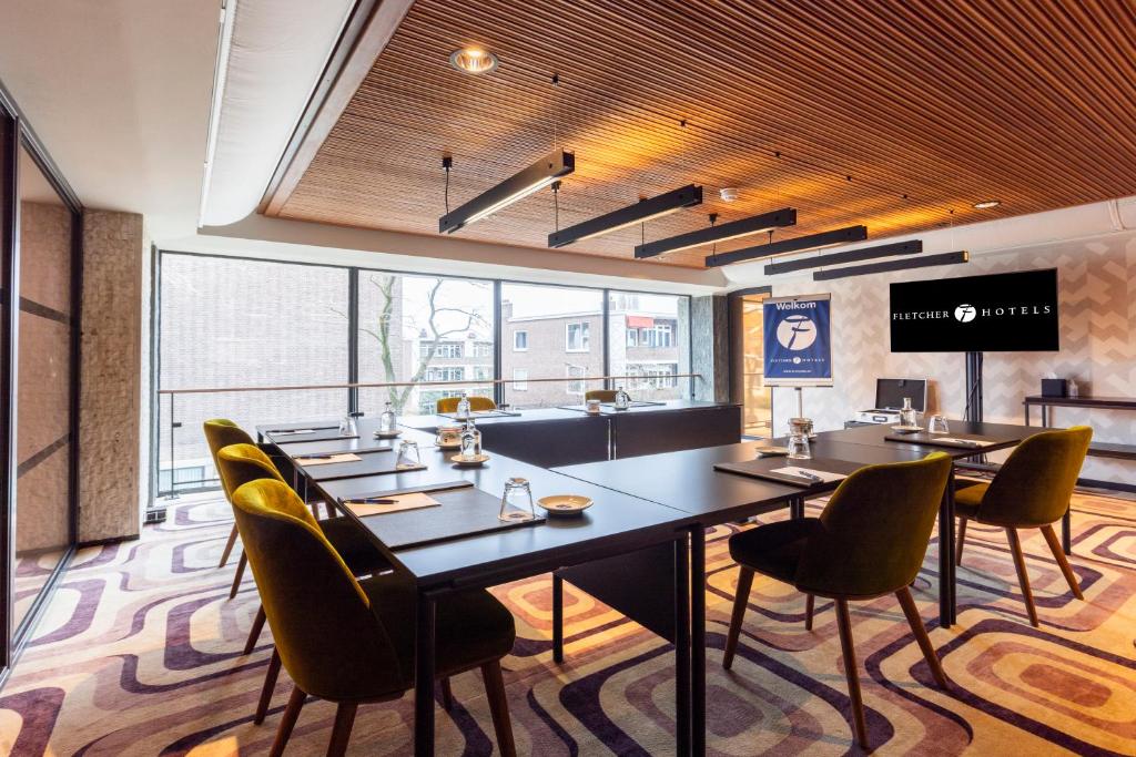 TV a/nebo společenská místnost v ubytování Fletcher Boutique Hotel Slaak-Rotterdam