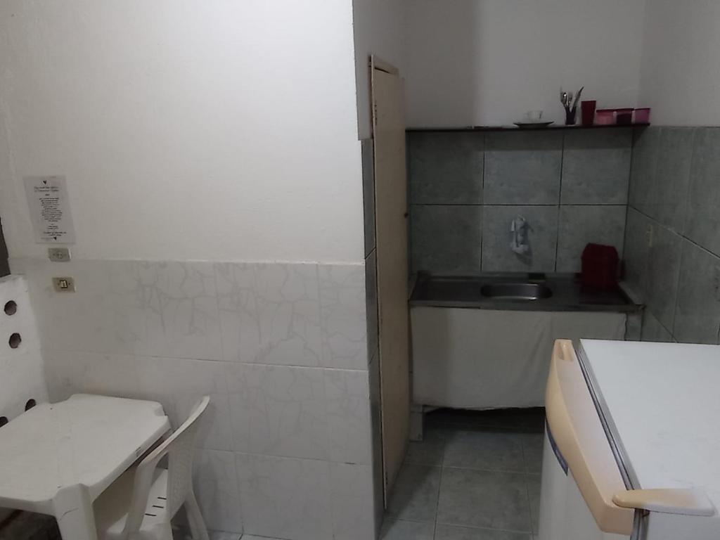 a small bathroom with a sink and a toilet at Residencial Barbosa 103 in Macaé
