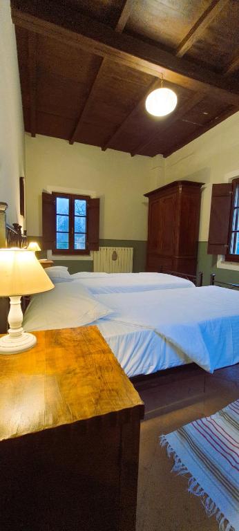 Postel nebo postele na pokoji v ubytování AGRITURISMO LE CORTI DELLA GUALDANA