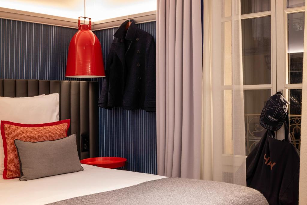 Postel nebo postele na pokoji v ubytování Hotel D Geneva