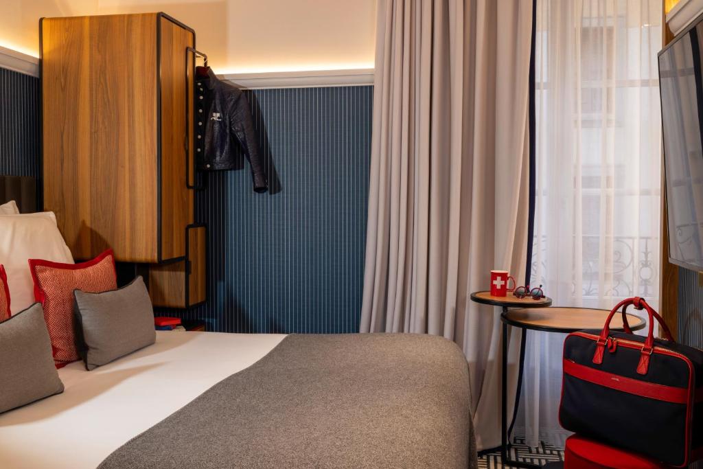 Postel nebo postele na pokoji v ubytování Hotel D Geneva