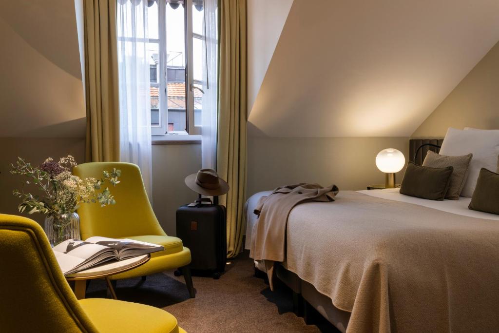 Postel nebo postele na pokoji v ubytování Hotel D Geneva