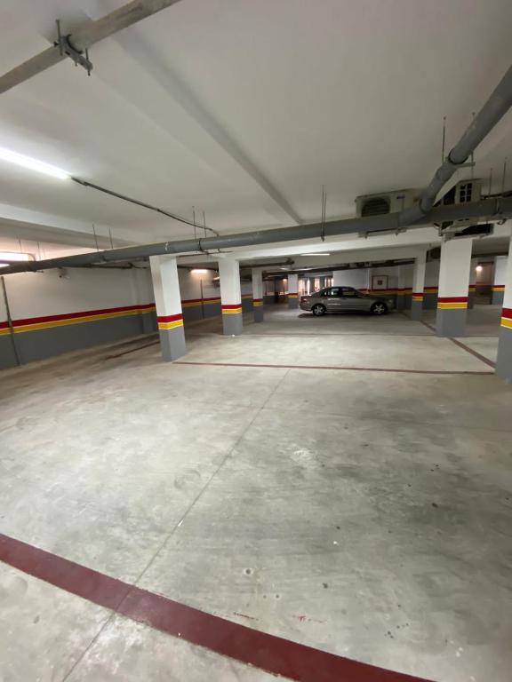 an empty parking garage with a car parked in it at Smir Park,Tetouan in Marina Smir