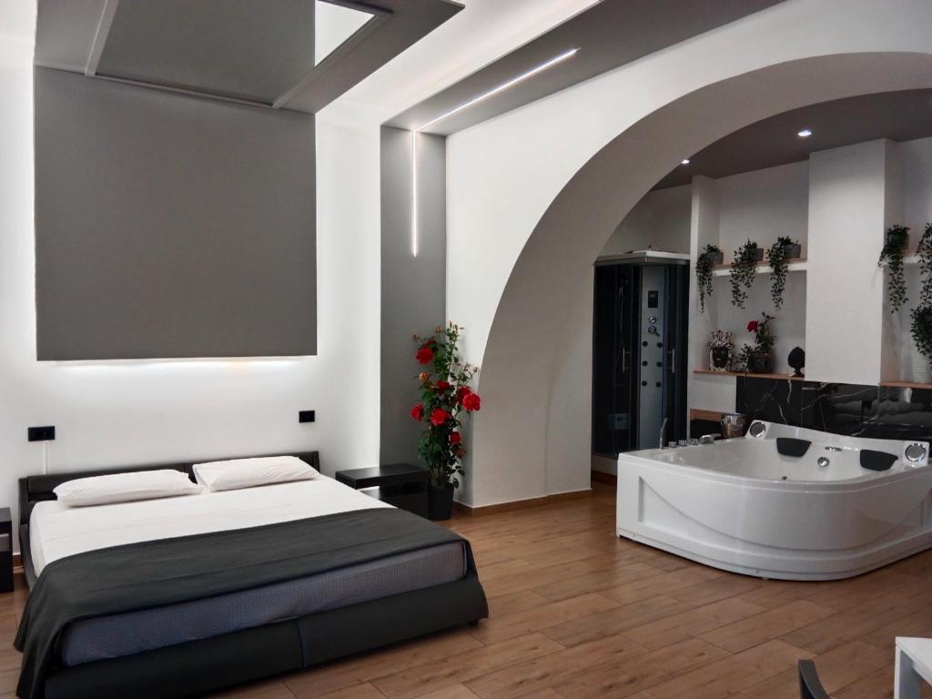 Ένα ή περισσότερα κρεβάτια σε δωμάτιο στο Catania Station Luxury Suite