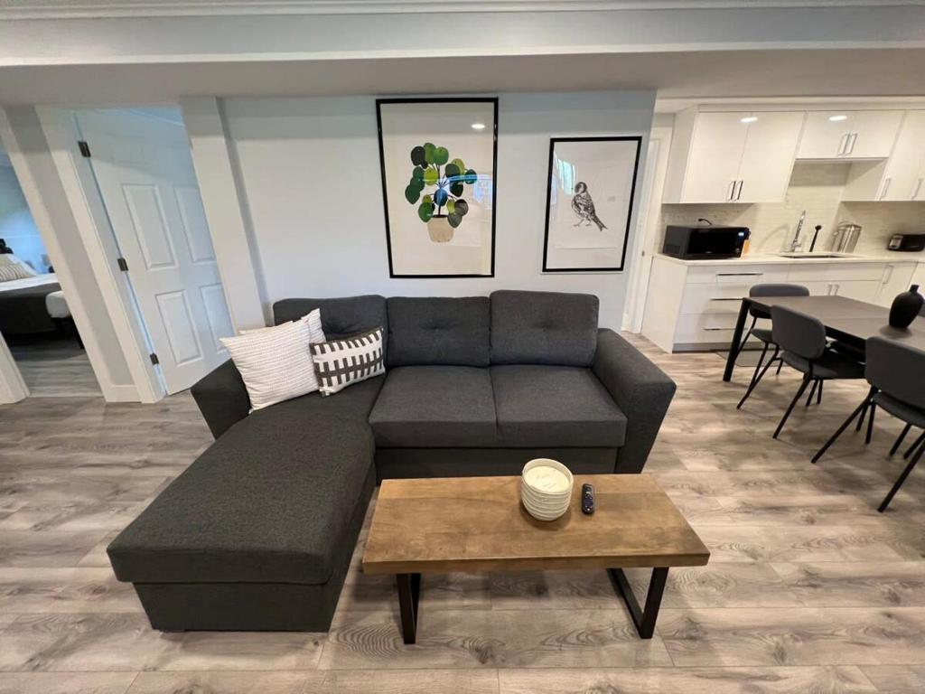 a living room with a couch and a table at River View House Basement in Kamloops