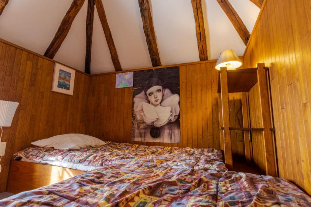 Una cama o camas en una habitaci&oacute;n de Le Pigeonnier de Sinzelle