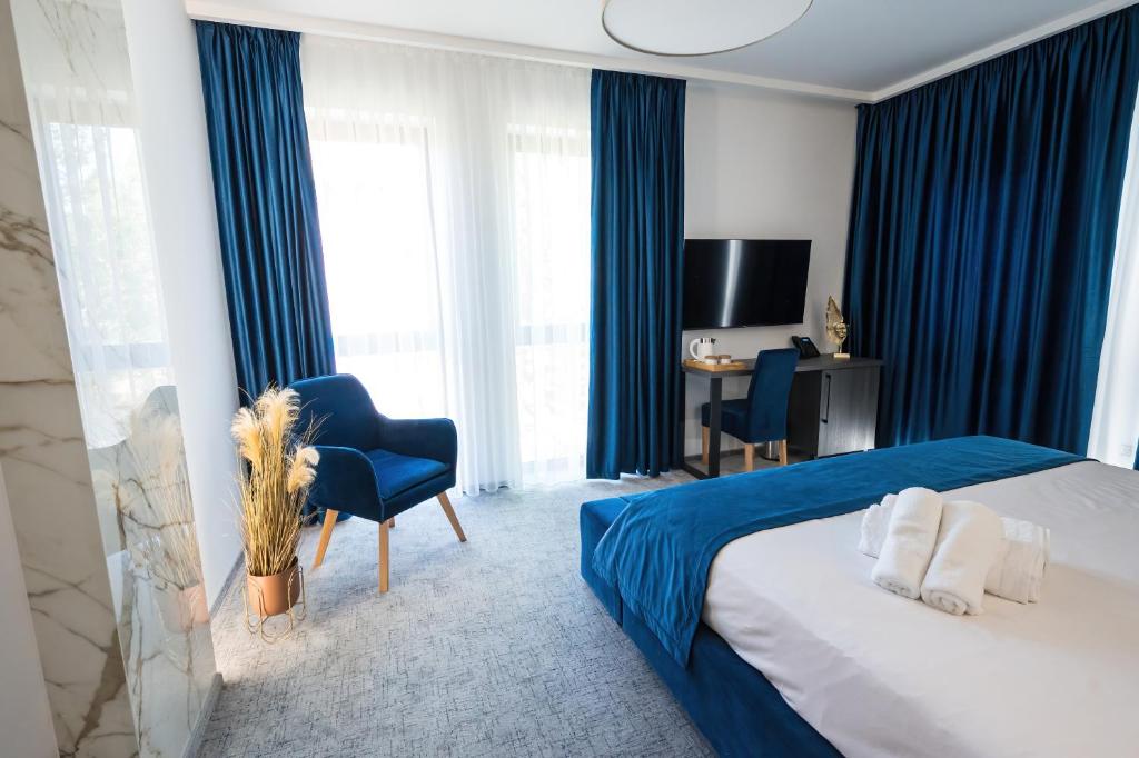 Postel nebo postele na pokoji v ubytování ALIVE HOTEL
