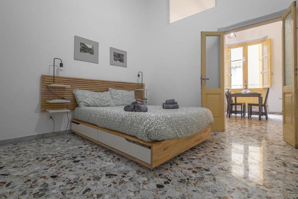 a bedroom with a bed and a dining room at U Paradise - Intero Apt - Vicino Bari in Valenzano