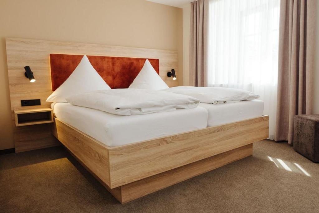 Postel nebo postele na pokoji v ubytování Hotel Sixt