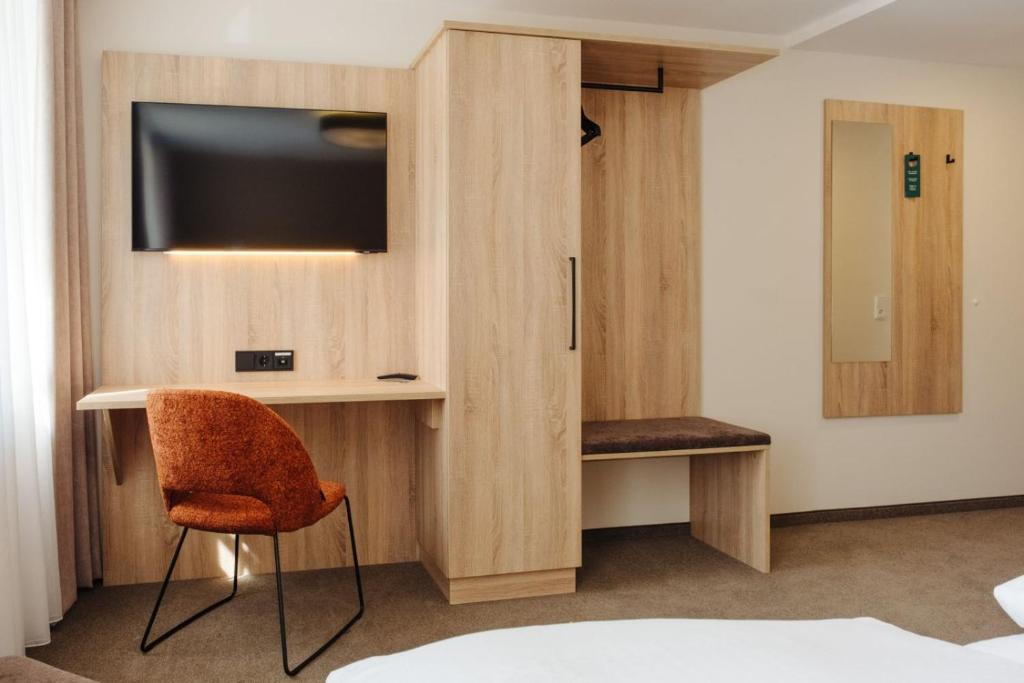 TV a/nebo společenská místnost v ubytování Hotel Sixt