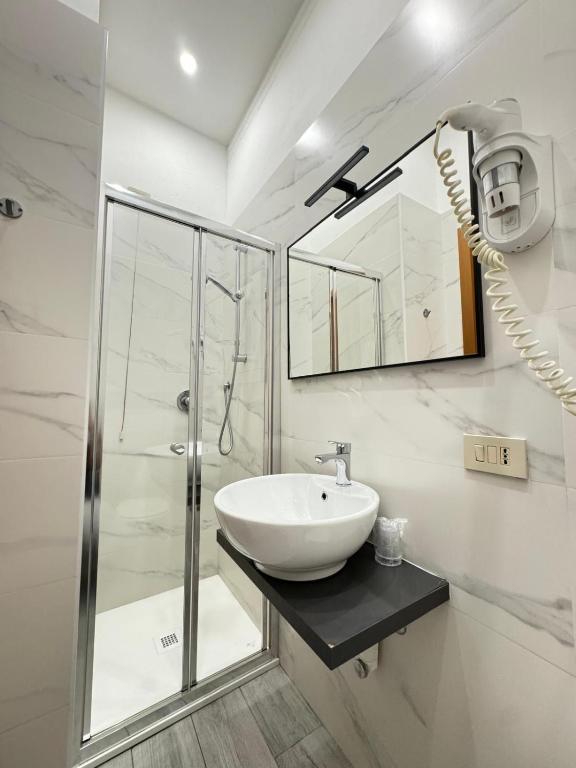 Koupelna v ubytování Hotel Le Querce