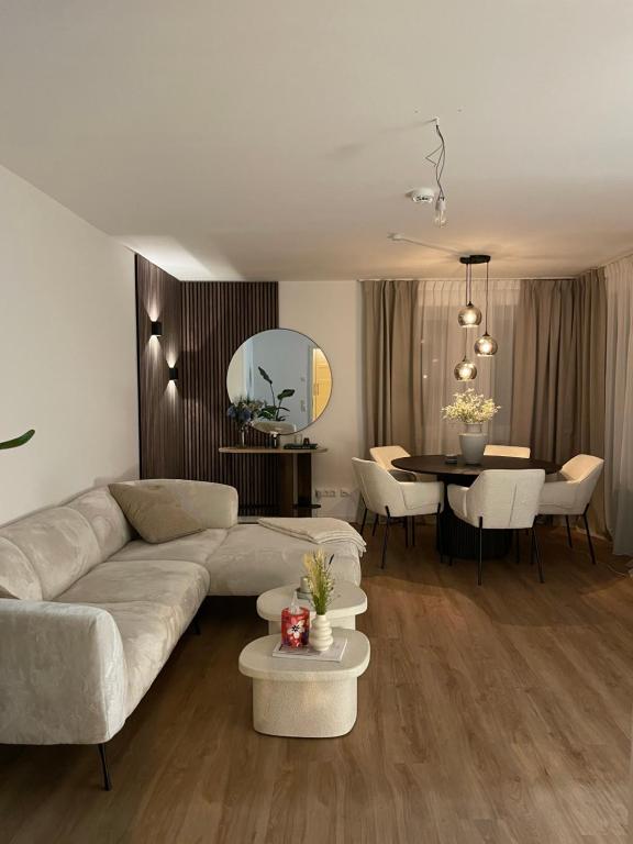 a living room with a couch and a table at KG Apartment in Hannover