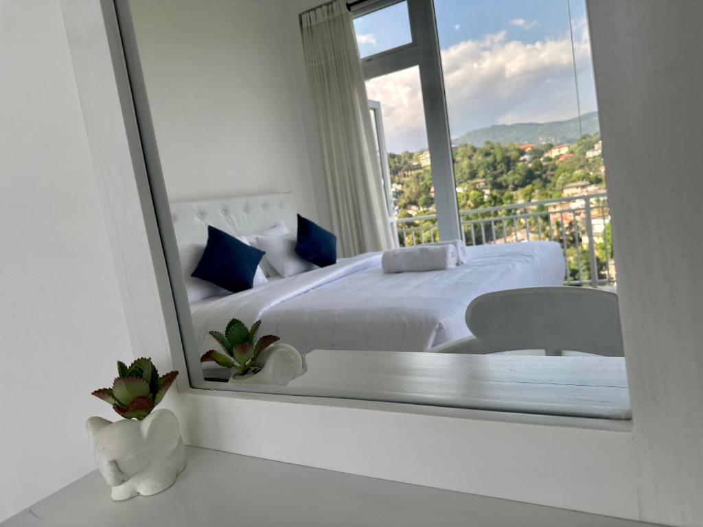 Postel nebo postele na pokoji v ubytování Secret Heaven Kandy