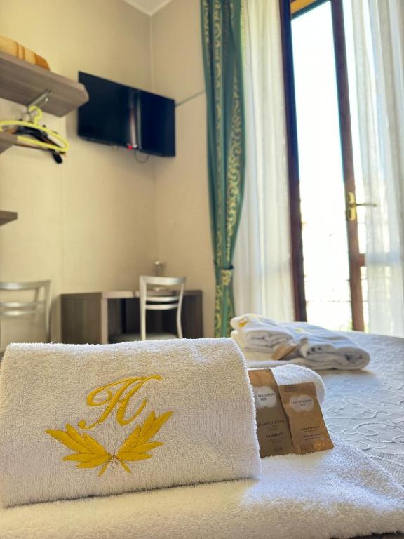 Postel nebo postele na pokoji v ubytování Hotel Le Querce