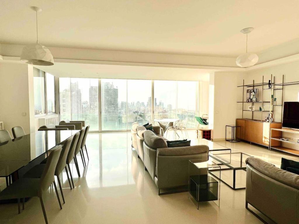 a living room with a couch and a table at Gorgeous 3Br Achrafieh Apt in Beirut
