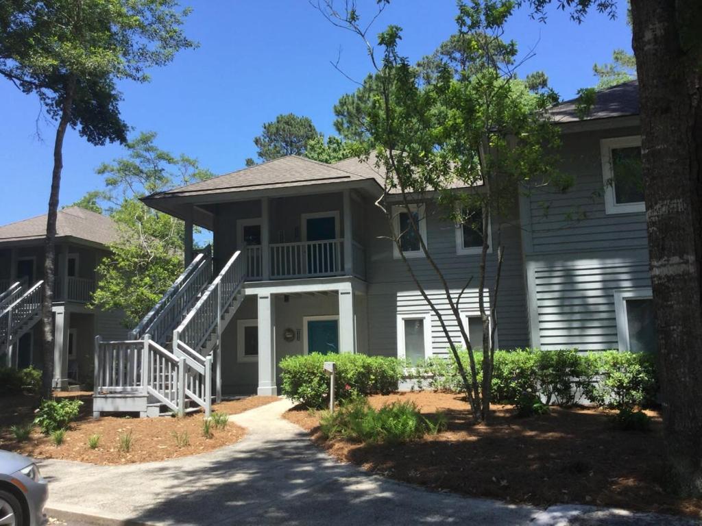 a house with a staircase in front of it at Tidewater Teal Lake 1323 in North Myrtle Beach