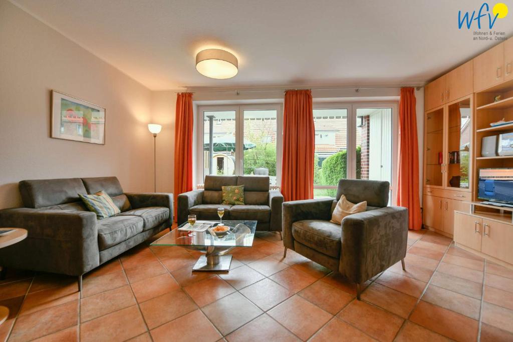 Posezení v ubytování Ferienhäuser Jadehörn Ferienhaus Casa Verde