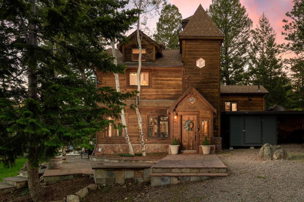 a large wooden house with a tower at Evergreen Castle - SLEEPS 8 - Close to skiing in Evergreen