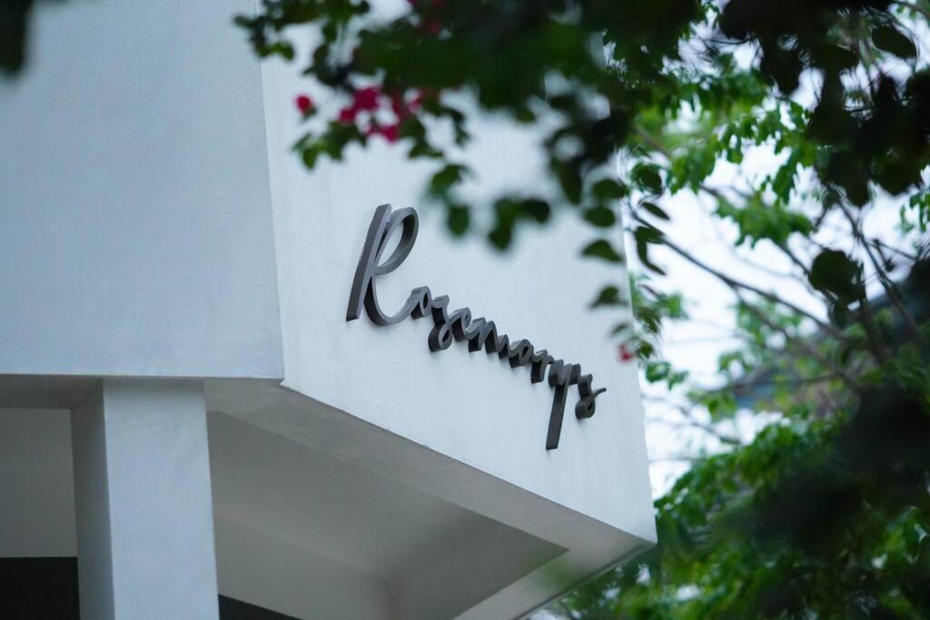 a sign for a restaurant on top of a building at Rosemary's in Ha Long