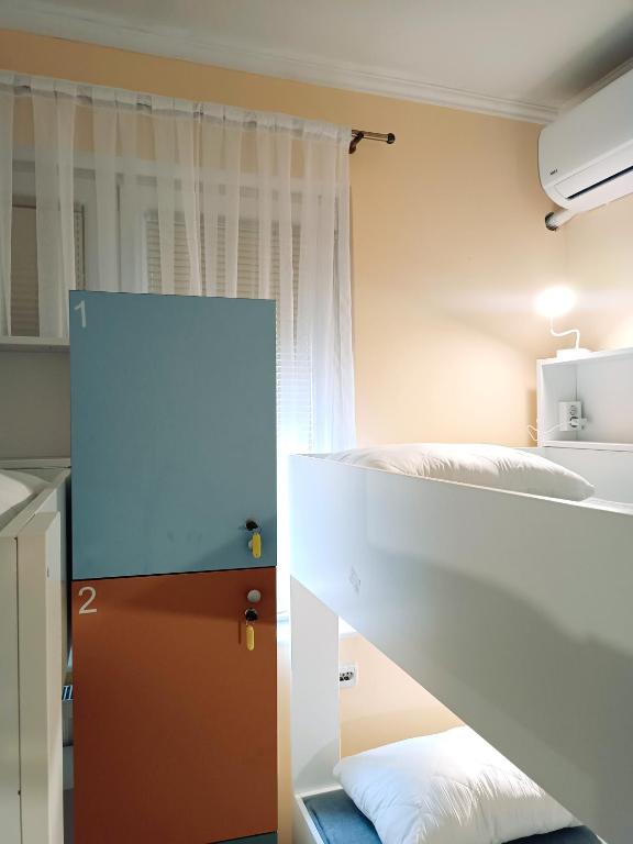 Postel nebo postele na pokoji v ubytování Hostel Central Skopje
