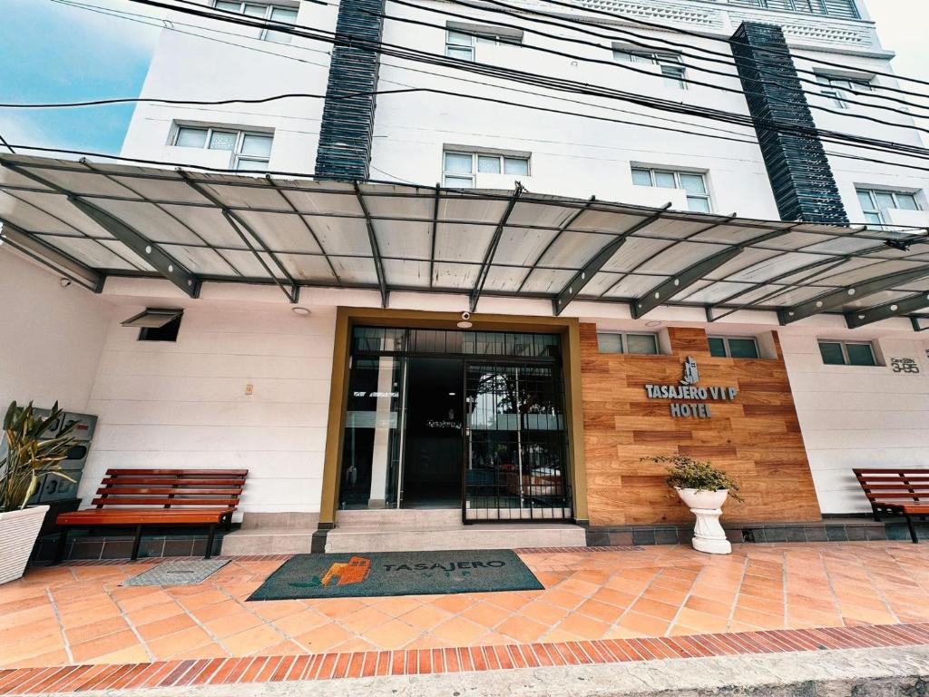 a building with awning in front of a building at HOTEL TASAJERO VIP in Cúcuta