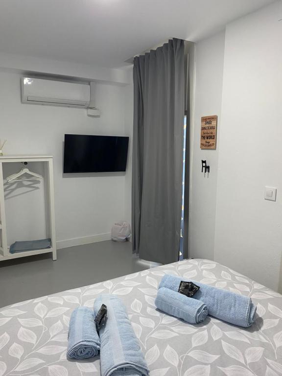 Postel nebo postele na pokoji v ubytování Sotavento Alpisteras