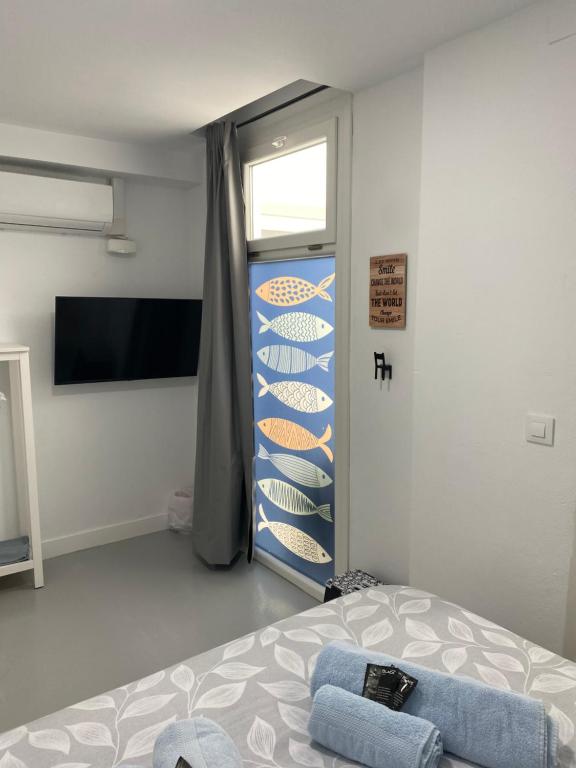 Postel nebo postele na pokoji v ubytování Sotavento Alpisteras