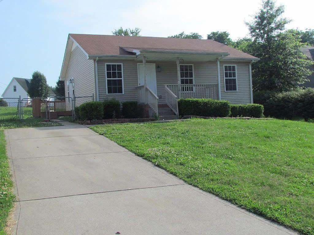 a small house with a sidewalk in front of it at Beautiful cul-de-sac home!!! with a FENCED IN YARD! in Clarksville