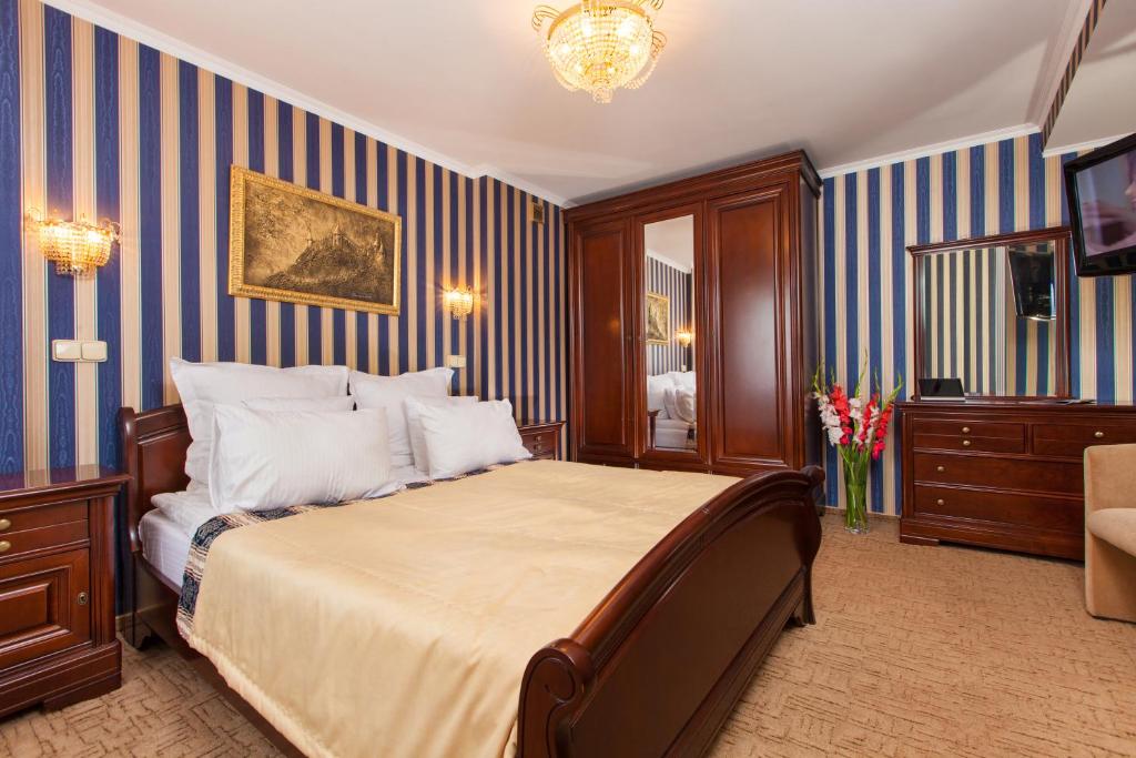 Postel nebo postele na pokoji v ubytování Conference Hotel Suputnyk