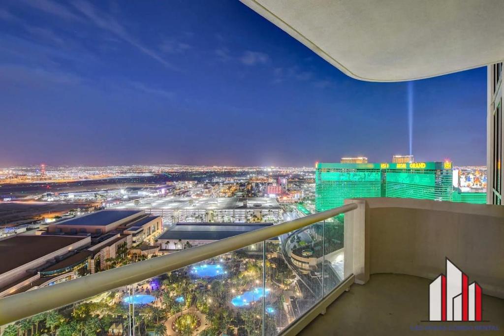 a view of a city at night from a building at MGM Signature-28-602 1Br 2Ba Balcony Jacuzzi Suite in Las Vegas