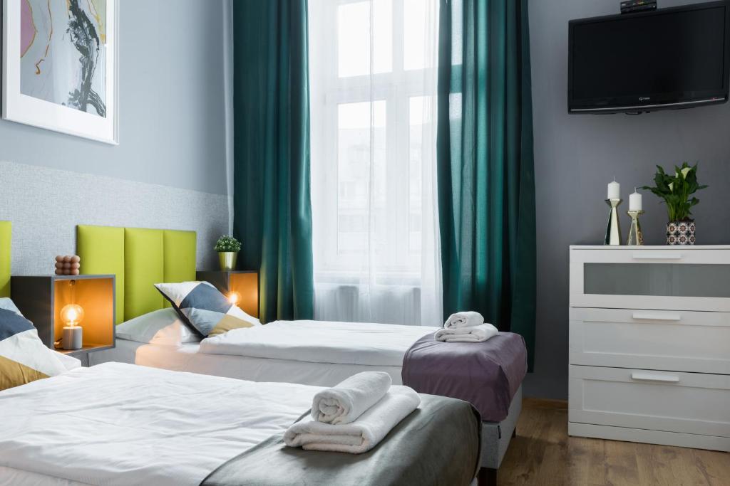 Posteľ alebo postele v izbe v ubytovaní Friendhouse Apartments Starovislna
