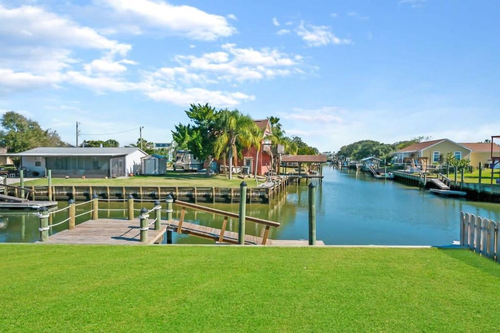 a view of a river with houses and a dock at Canal Front Home! Walk to Beach, Porch, Fishing in St. Augustine