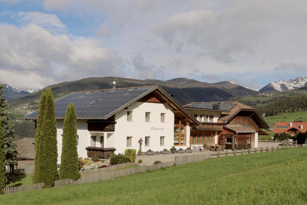 a house with solar panels on the roof at Obergasserhof in Rodengo