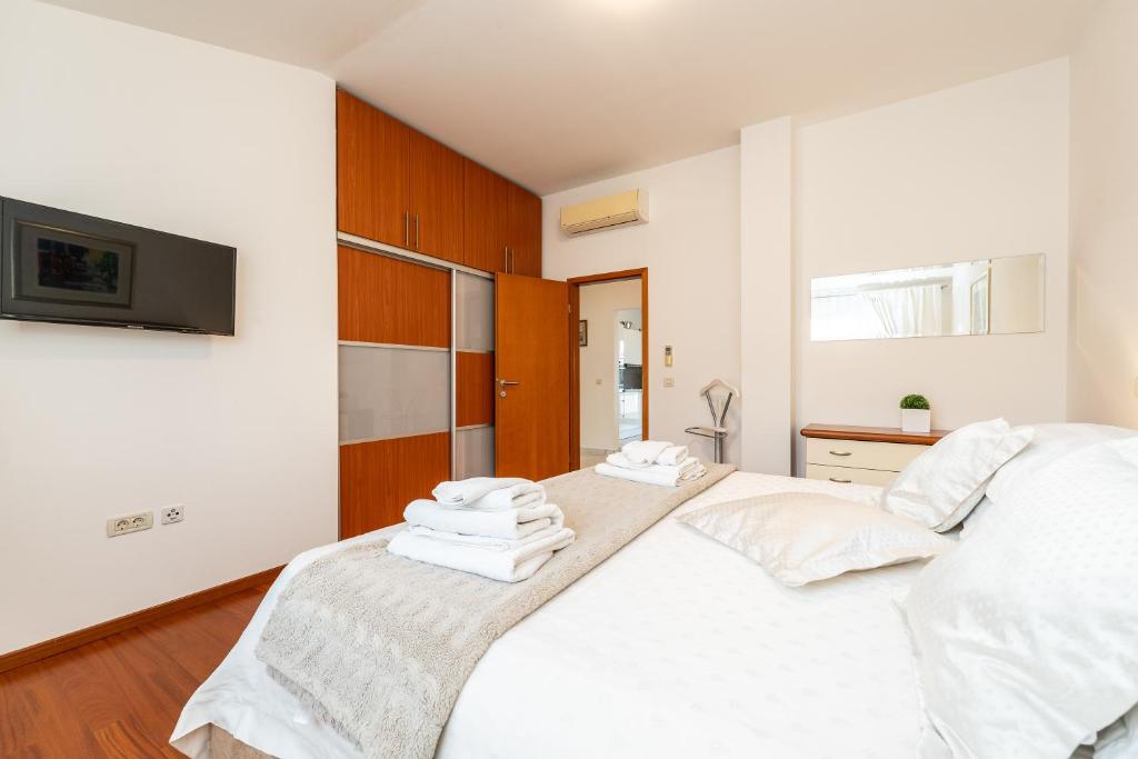 Postel nebo postele na pokoji v ubytování Apartments Very Good Life