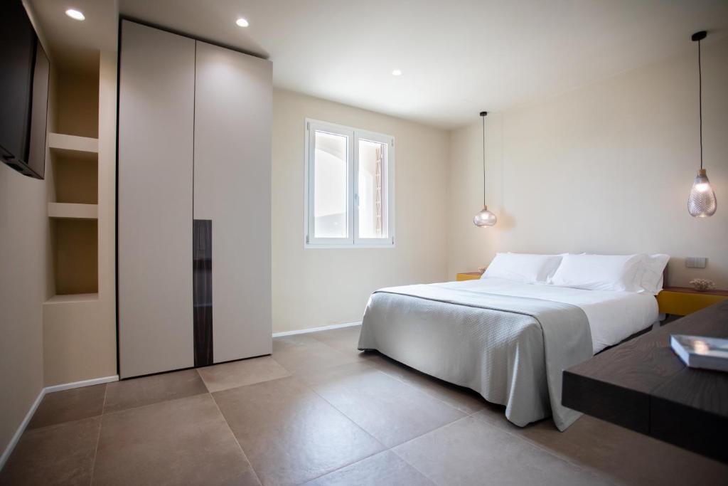 Postel nebo postele na pokoji v ubytování Villa Marina Verde by Le Dune Villas