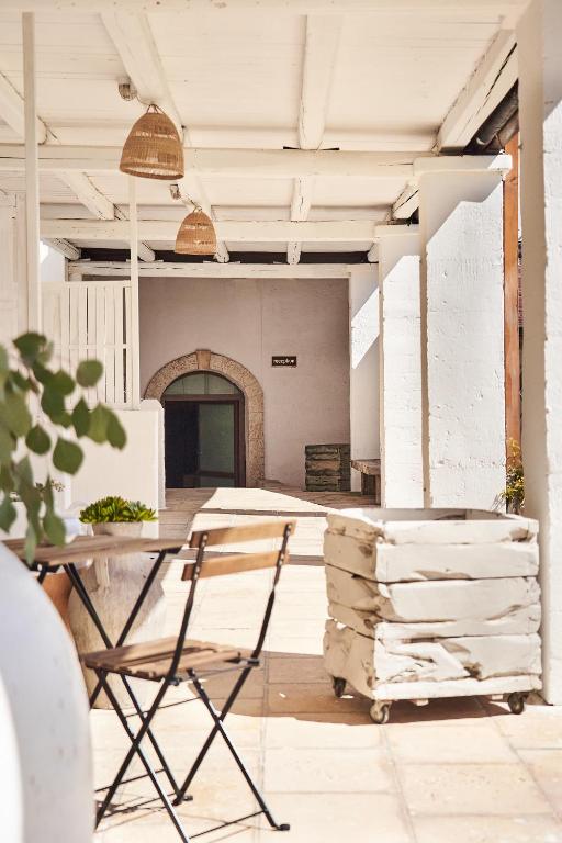 a room with a table and a stack of wood at Il Trappetello in Monopoli
